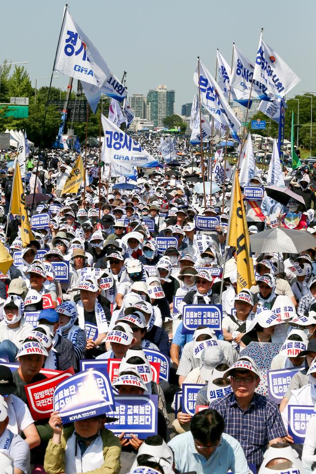 Participants from across the country hold signs at a rally in Yeouido Seoul June 18 2024 AJU PRESS Kim Dong-woo