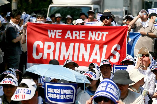 Participants hold banners at a rally Yeouido Seoul June 18 2024AJU PRESS Kim Dong-woo