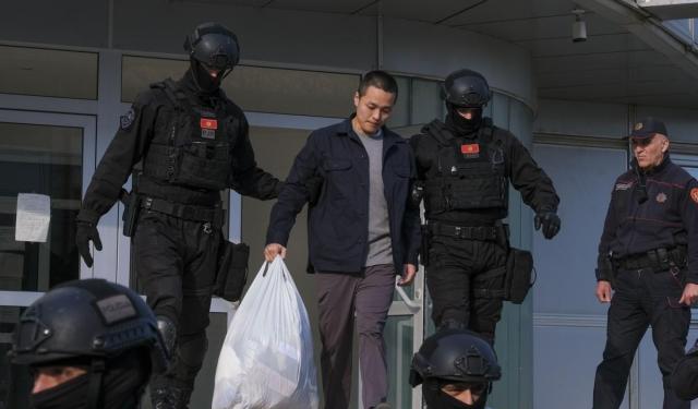 This photo shows Do Kwon with Montenegrin police officers on March 23 2024 AP  Yonhap