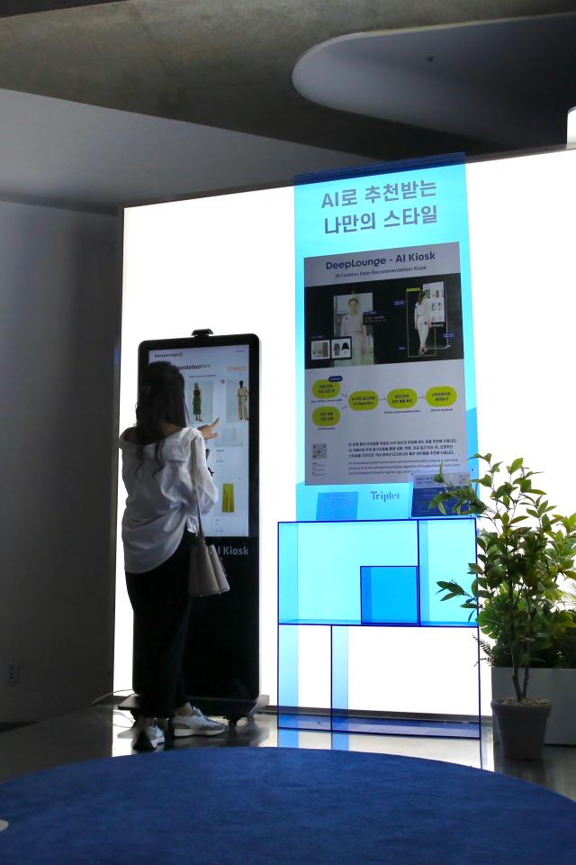 A visitor tries out the AI Style Recommendation booth at DDP Showroom on June 10 2024 AJU PRESS Han Jun-gu