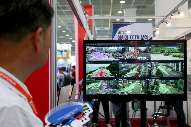 A visitor looks at a live CCTV monitoring screen at SmartTech Korea at COEX in Seoul on June 19 2024 AJU PRESS Kim Dong-woo