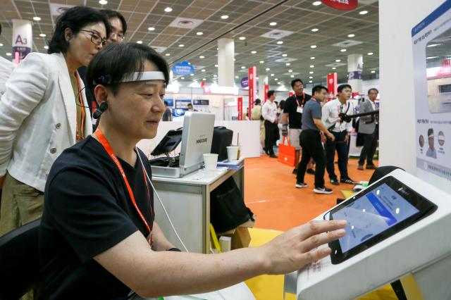 A visitor experiences smart healthcare at Smart Tech Korea at COEX in Seoul on June 19 2024 AJU PRESS Kim Dong-woo