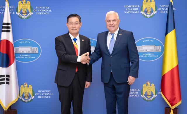 Defense Minister Shin Won-sik left shakes hands with Romanian Defense Minister Angel Tilvar during their meeting at the Romanian Ministry of Defense on June 19 2024 Courtesy of the Ministry of National Defense
