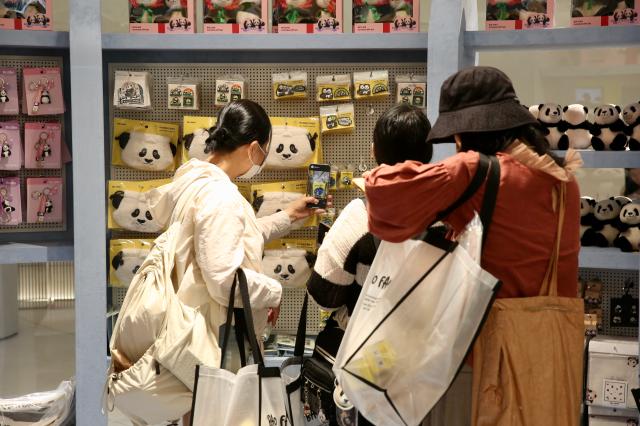 Visitors take pictures of goods at the Bao Family Pop-up Store Season 2 held at The Hyundai Seoul on June 20 2024 AJU PRESS Han Jun-gu