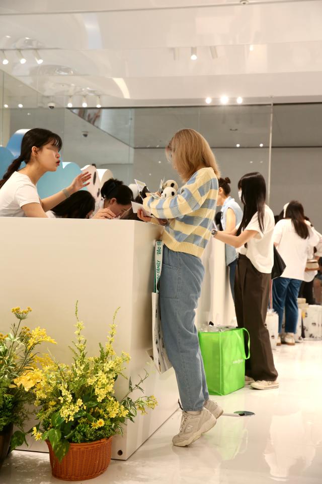 Visitors purchase goods at the counter of the Bao Family Pop-up Store Season 2 held at The Hyundai Seoul on June 20 2024 AJU PRESS Han Jun-gu