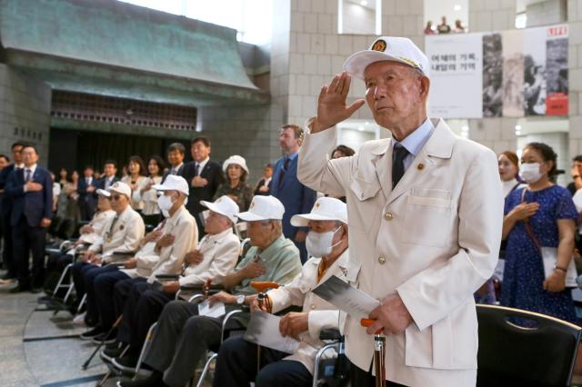 A Korean War veteran salutes during the opening ceremony of the We Have Not Forgotten Them exhibition at the War Memorial in Yongsan-gu Seoul on June 20 2024