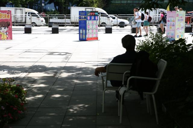 A man rests on a chair in the shade at Gwanghwamun Square June 21 2024 AJU PRESS Han Jun-gu