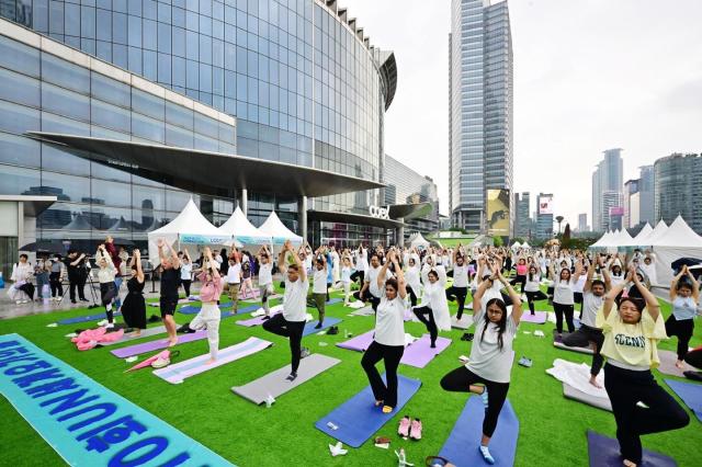 Yoga Enthusiasts and practitioners participate in group activities at the 10th International Yoga Day event held in southern Seoul on June 22 Courtesy of the Indian Embassy in the Republic of Korea