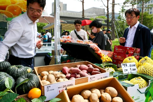 A booth representative sells goods at the 2024 Young Ho Nam Win-Win Cooperation the Grand Festival of Harmony Gwanghwamun Square in Seoul on June 24 2024 AJU PRESS Kim Dong-woo