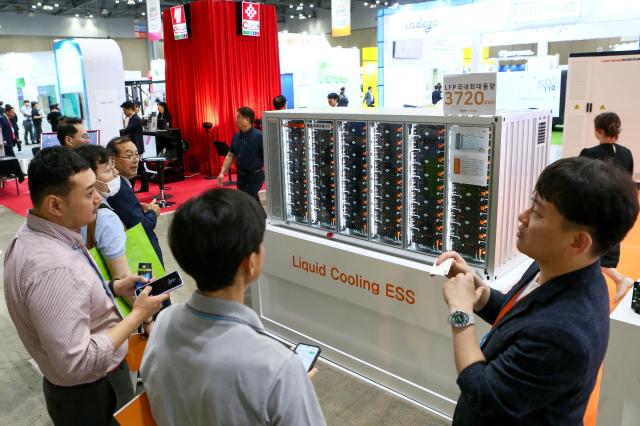 Visitors listen to a booth official at Expo Solar  PV Korea 2024 at KINTEX in Goyang west of Seoul on June 25 2024 AJU PRESS Kim Dong-woo