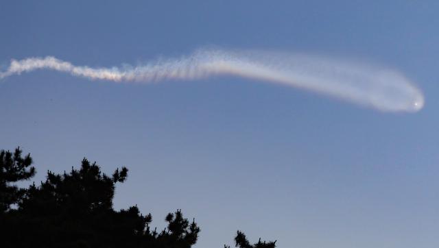 A long contrail presumed to be from a North Korean ballistic missile is stretched over the sea near Daeyeonpyeong Island in Ongjin County Incheon at around 532 am on June 26 Yonhap Photo