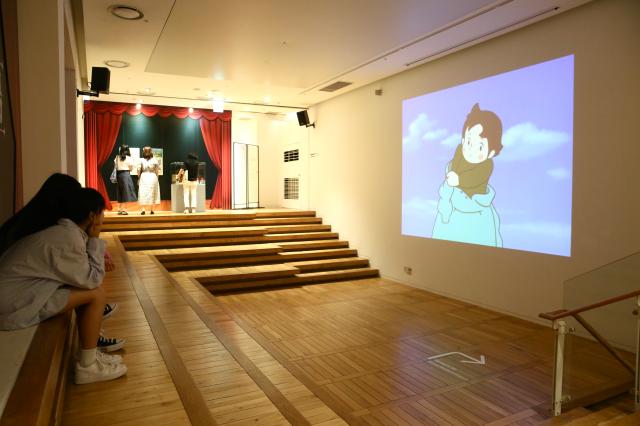 Visitors watch an animation at the Studio Ghibli - Isao Takahata Exhibition held at the Sejong Center in Seoul on June 26 2024 AJU PRESS Han Jun-gu