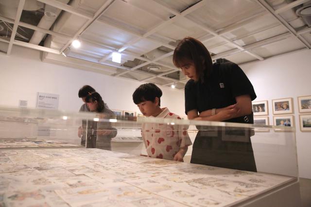 Visitors view the exhibits at the Studio Ghibli - Isao Takahata Exhibition at the Sejong Center in Seoul on June 26 2024 AJU PRESS Han Jun-gu