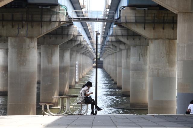 A visitor relaxes at Yeouido Hangang Park in Seoul on June 27 2024 AJU PRESS Han Jun-gu