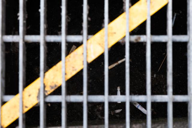 Storm drain cover with yellow line cigarette butts and trash visible beneath near Gangnam Station Seoul June 28 2024 AJU PRESS Park Jong-hyeok