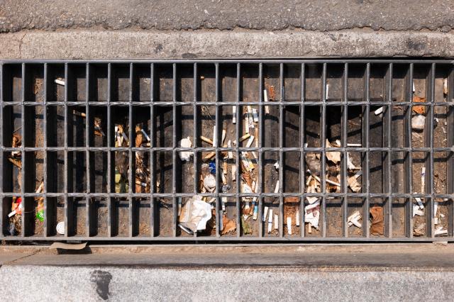 Storm drain cover near Gwanghwamun Station Seoul still clogged with debris June 28 2024 AJU PRESS Park Jong-hyeok