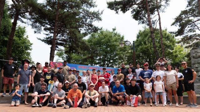 All participants of street hockey tournament gather for group photo at Jeongdong Park in central Seoul July 1 2024 AJU PRESS Park Jong-hyeok
