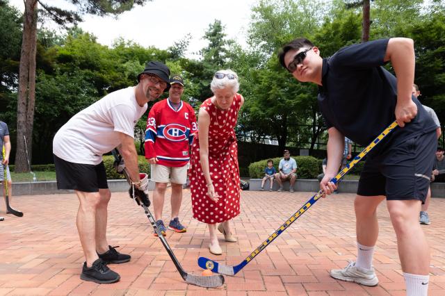 Ambassador Tamara Mawhinney Ambassador of Canada to South Korea drops the puck at the beginning of the final match between Canada Ball Hockey Team 1 and the Incheon Naval Sector Defense Command team