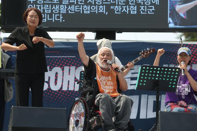 Representative Park Kyung-suk raises a fist while chanting slogans during the Move Toward Parade organized by SADD in front of the National Assembly on July 1 2024 AJU PRESS Han Jun-gu