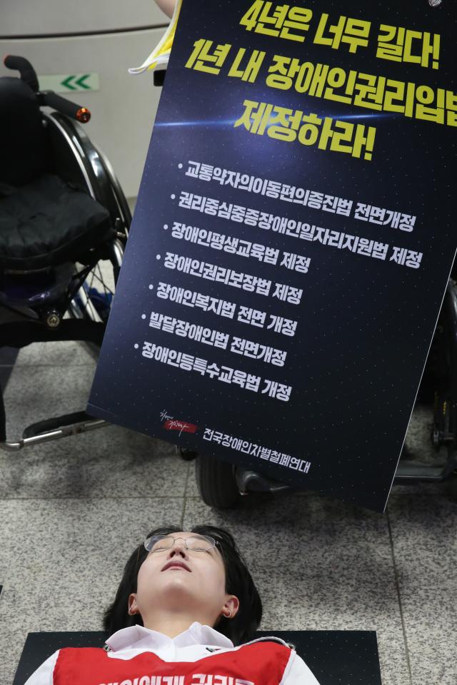 A Protester performs a die-in during the Move Toward Parade organized by SADD at the National Assembly station platform on July 2 2024 AJU PRESS Han Jun-gu