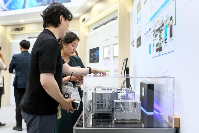 A Visitor listen to a booth official at the Nano Korea 2024 at KINTEX in Goyang west of Seoul on July 3 2024 AJU PRESS Kim Dong-woo