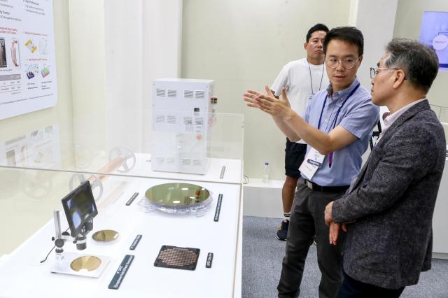 A visitor listen to a booth official at the Nano Korea 2024 at KINTEX in Goyang west of Seoul on July 3 2024 AJU PRESS Kim Dong-woo
