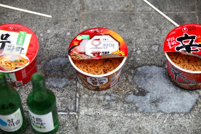 Soggy ramyeon and alcohol for the victims are placed at the accident site near City Hall Station in Seoul on July 4 2024 AJU PRESS Han Jun-gu