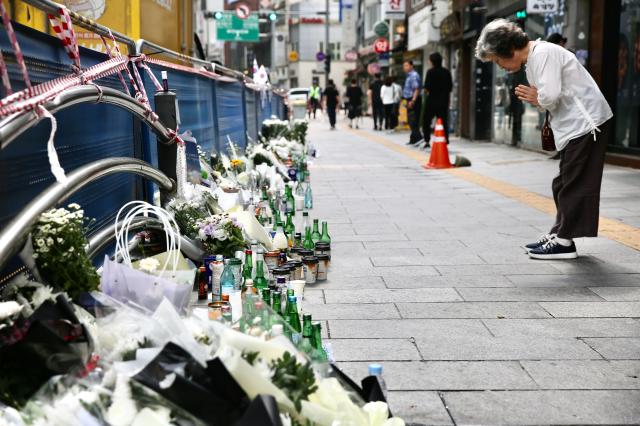 A person prays for the victims at the accident site near City Hall Station in Seoul on July 4 2024 AJU PRESS Han Jun-gu