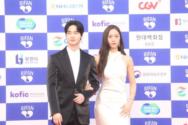 Actor Jang Dong-yoon left and actress Jung Soo-jung also known as Krystal attend a red carpet event of the annual Bucheon International Fantastic Film Festival on July 4 2024 They hosted the opening event of the festival