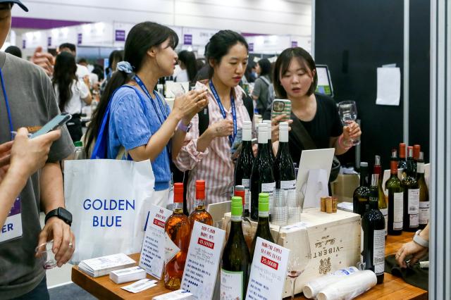 Visitors takes a photo at Seoul International Wine  Spirits Expo at COEX in Seoul on July 4 2024 AJU PRESS Kim Dong-woo