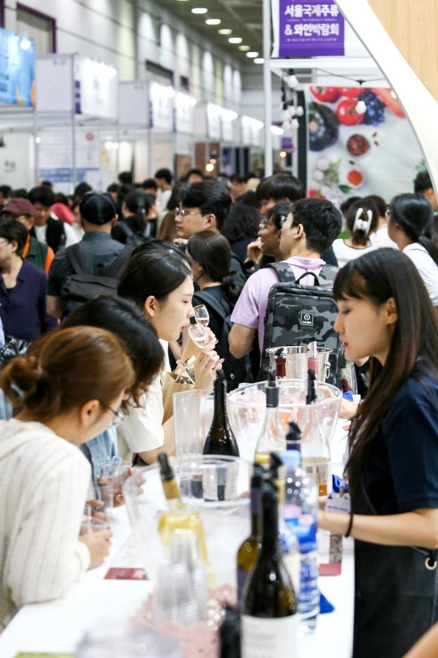 Visitors are tasting wine at Seoul International Wine  Spirits Expo at COEX in Seoul on July 4 2024 AJU PRESS Kim Dong-woo