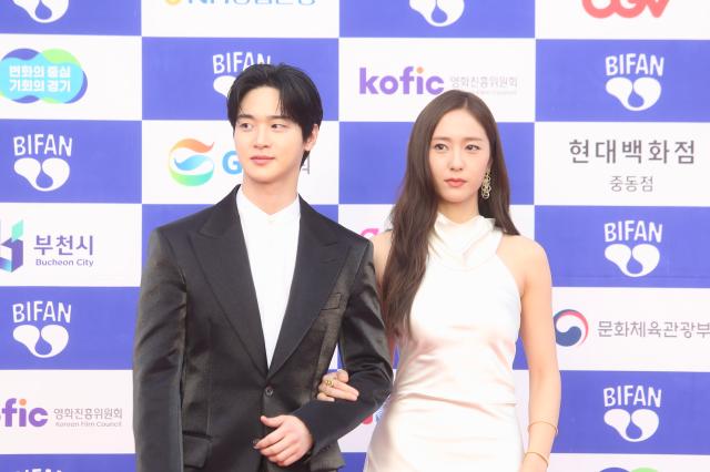 Jang Dong-yoon and Jung Soo-jung  stand in front of the photo wall at the 28th Bucheon International Fantastic Film Festival in Gyeonggi Province on July 4 2024 AJU PRESS Han Jun-gu