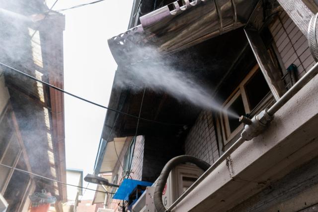 A cooling fog system operates in the Donui-dong jjokbang village in Seoul on the morning of July 11 2024 AJU PRESS Park Jong-hyeok