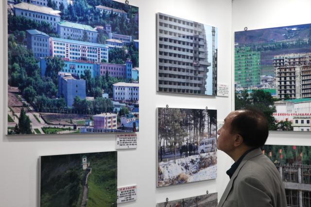 A person views photos at the exhibition Spotlighting North Korean human rights through pictures held at Seoul City Halls Citizens Hall on July 8 2024 AJU PRESS Han Jun-gu