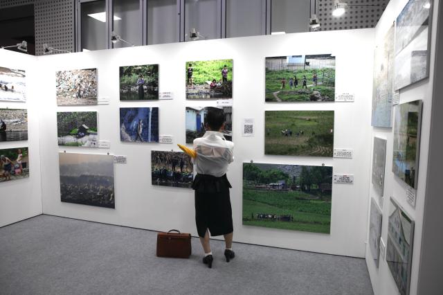 A person views photos at the exhibition Spotlighting North Korean human rights through pictures held at Seoul City Halls Citizens Hall on July 8 2024 AJU PRESS Han Jun-gu