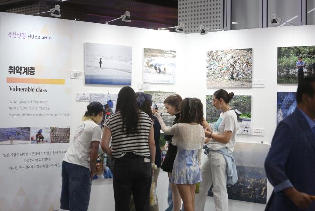 People view photos at the exhibition Spotlighting North Korean human rights through pictures held at Seoul City Halls Citizens Hall on July 8 2024 AJU PRESS Han Jun-gu