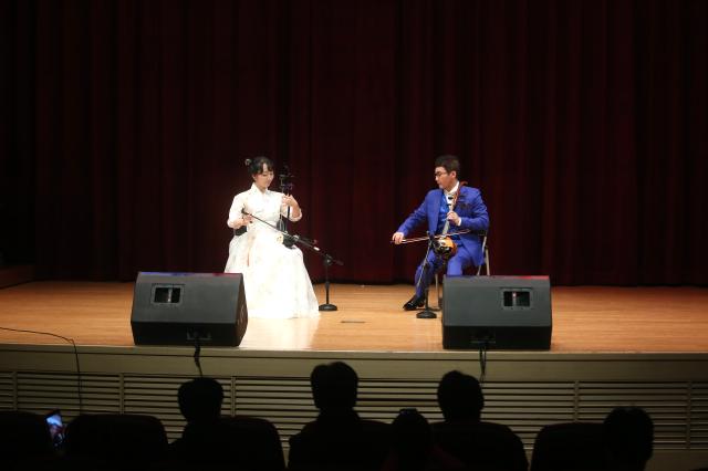 South Korean Kim Sun-hee and Park Sung-jin a member of the Pyongyang Arirang Art Association composed of North Korean defectors play the haegeumKorean traditional string instrument at the North Korean traditional culture and art performance in Yangcheon Seoul on July 8 2024 AJU PRESS Han Jun-gu