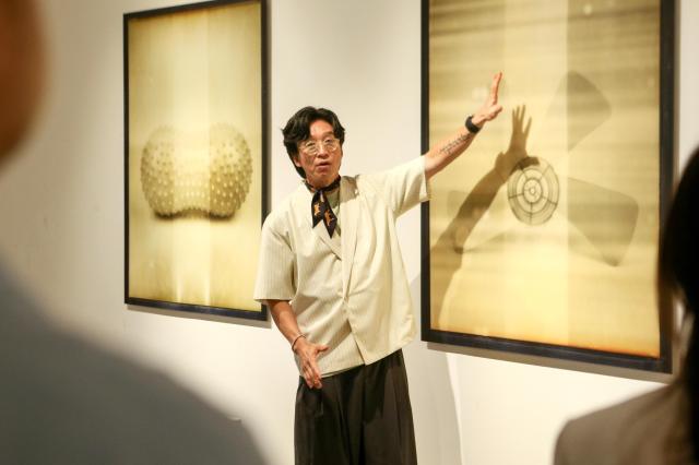 MJ Kim explains his work at the 22nd Century Relic Exhibition at Dream Forest Art Center in Seoul on July 11 2024 AJU PRESS Kim Dong-woo