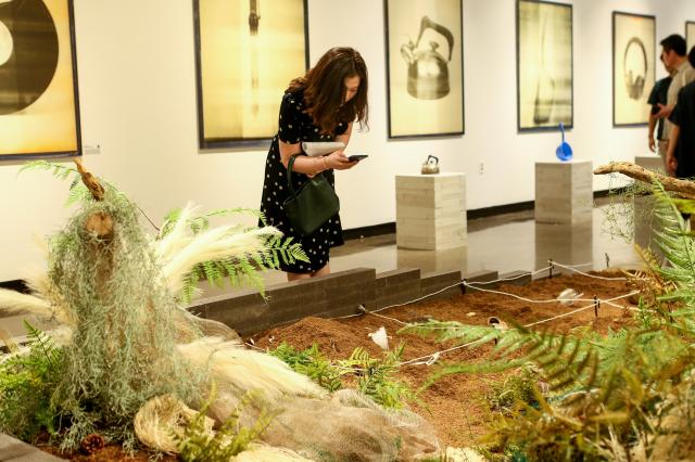 A visitor takes a photo at the 22nd Century Relic Exhibition at Dream Forest Art Center in Seoul on July 11 2024 AJU PRESS Kim Dong-woo