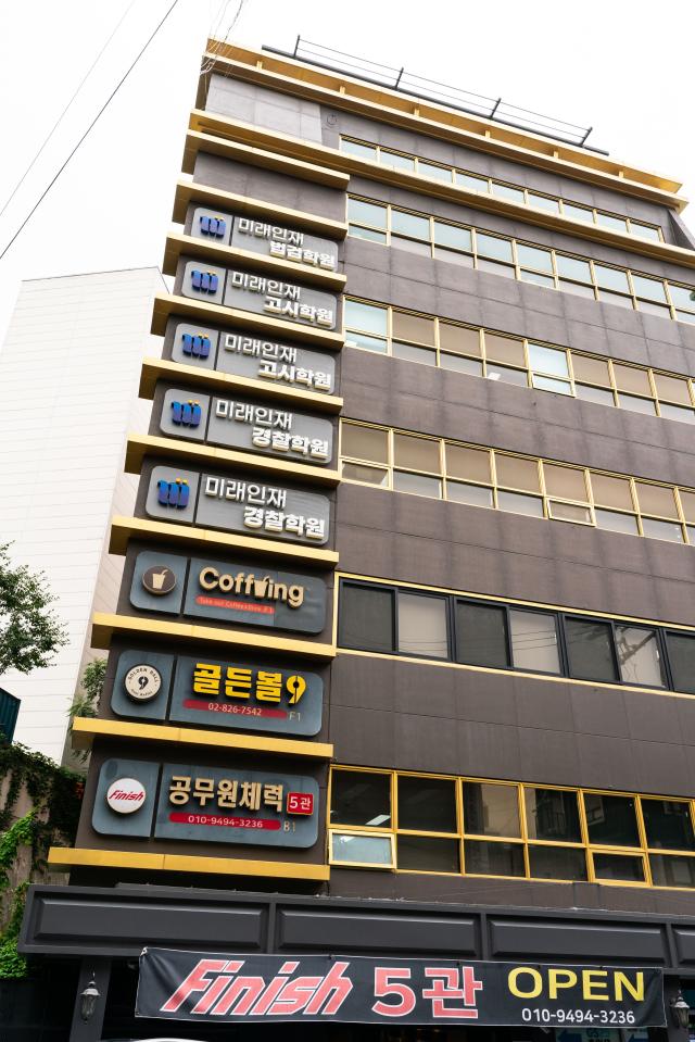 A typical multi-story building in Noryangjin Dongjak District Seoul photographed on July 12 2024 The structures layout with floors dedicated to academies and small eateries represents the traditional setup of this exam preparation hub now facing economic challenges AJU PRESS Park Jong-hyeok