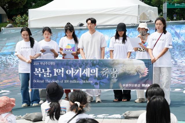 Members of Animal Liberation Wave participate in the 2024 Boknal Memorial Action in front of Bosingak Pavilion Seoul on July 15 2024 The event protests the traditional consumption of samgyetang a chicken soup dish during Koreas hottest summer days citing animal welfare concerns AJU PRESS Park Jong-hyeok