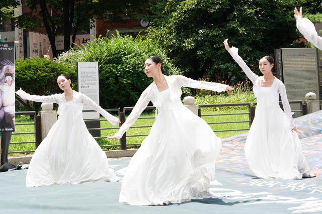 Dancers perform a traditional Korean dance to commemorate chickens used in samgyetang during the 2024 Boknal Memorial Action near Bosingak Pavilion in Seoul on July 15 2024 AJU PRESS Park Jong-hyeok