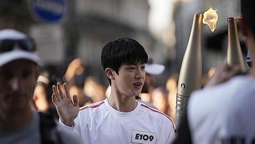 BTS Jin carries Olympic torch in Paris