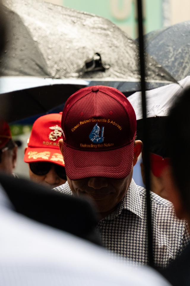 A former military general observes a moment of silence for fallen soldiers during a veterans protest in front of the Democratic Party headquarters in Yeouido Seoul on July 17 2024 AJU PRESS Park Jong-hyeok