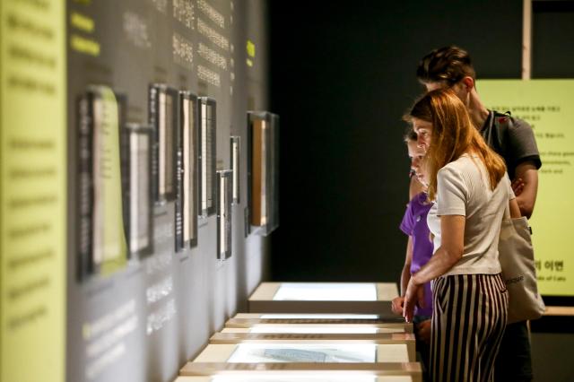 Visitors view exhibits at the Cat-ch me if you can at National Folk Museum in Seoul on July 17 2024 AJU PRESS Kim Dong-woo