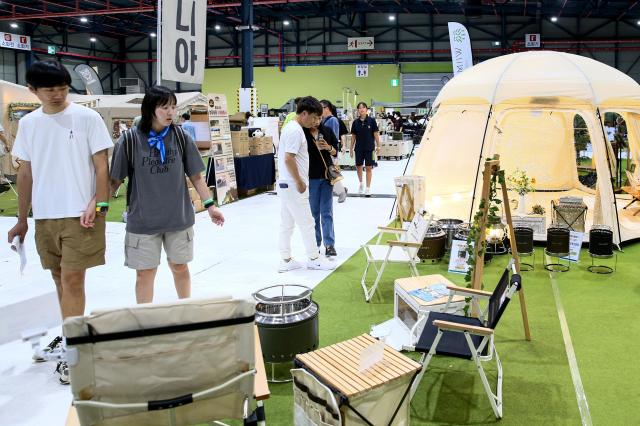 Visitors look around an exhibition at the Global Outdoor Camping  Leisure Sports Fair at SETEC in Gangnam Seoul on 19 July 2024 AJU PRESS Kim Dong-woo