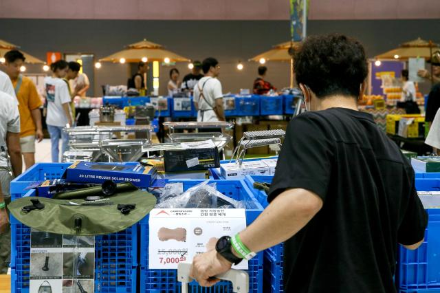 A visitor looks at items on display at Global Outdoor Camping  Leisure Sports Fair at SETEC in Gangnam Seoul on 19 July 2024 AJU PRESS Kim Dong-woo