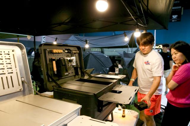 Visitor looks at items on display at Global Outdoor Camping  Leisure Sports Fair at SETEC in Gangnam Seoul on 19 July 2024 AJU PRESS Kim Dong-woo