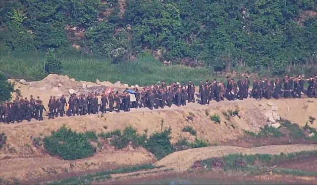 A numerous number of North Korean soldiers were detected near the construction site at the DMZ on June 18 2024 Courtesy of Joint Chiefs of Staff