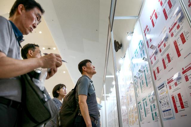 Visitors check the job postings at the 4050 Job Fair at Dongdaemun Design Plaza in Seoul on July 22 2024 AJU PRESS Kim Dong-woo